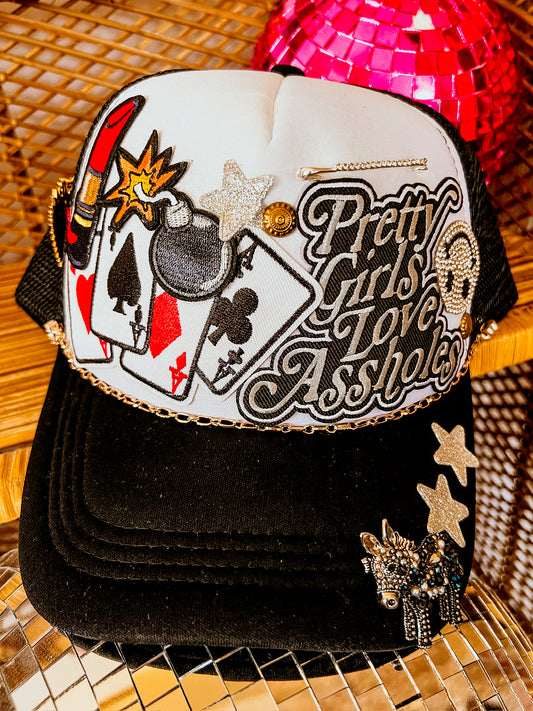 ONE OF A KIND PATCH TRUCKER HAT | Pretty Girls Love A**holes